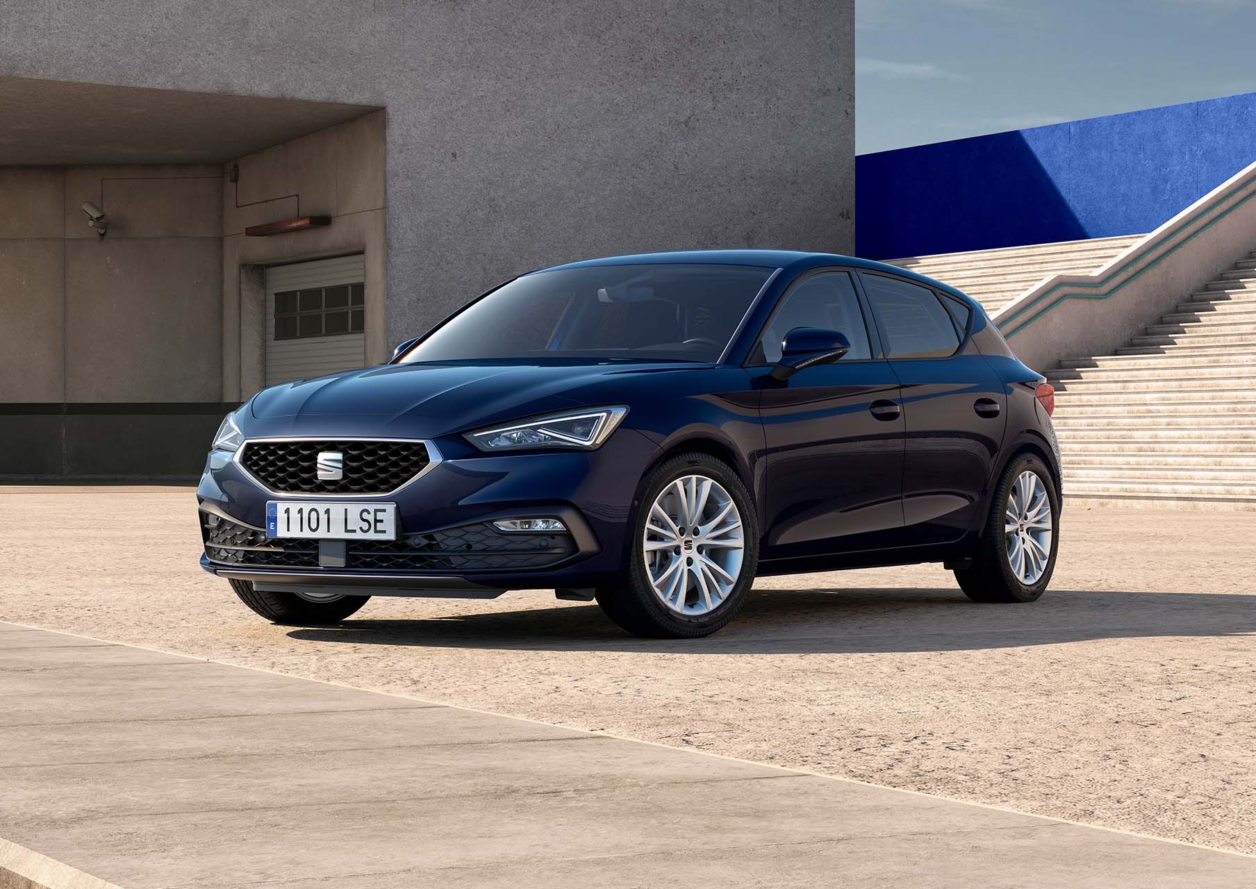 seat leon 5d style trim asphalt blue colour with dynamic alloy wheels parked